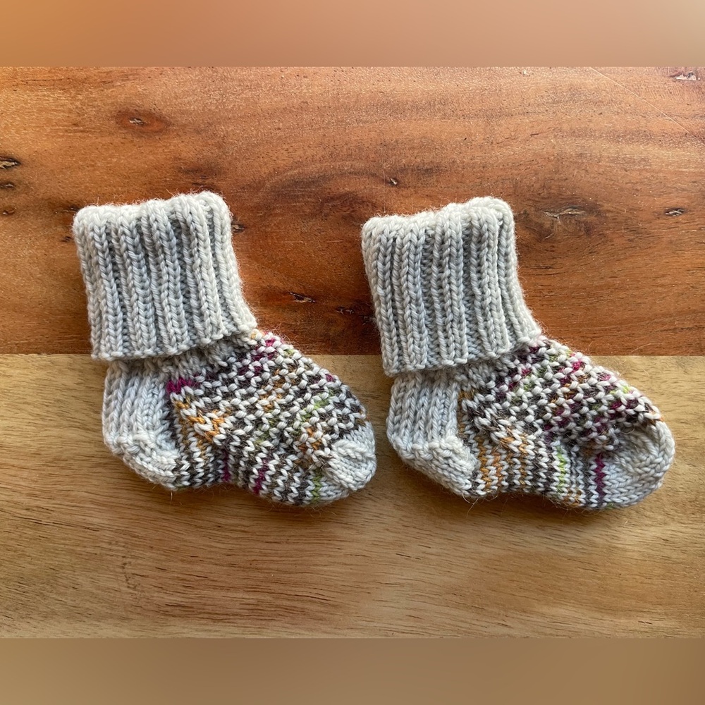 SOLD!
Hand knit Baby Socks—that will actually stay on your baby’s feet!